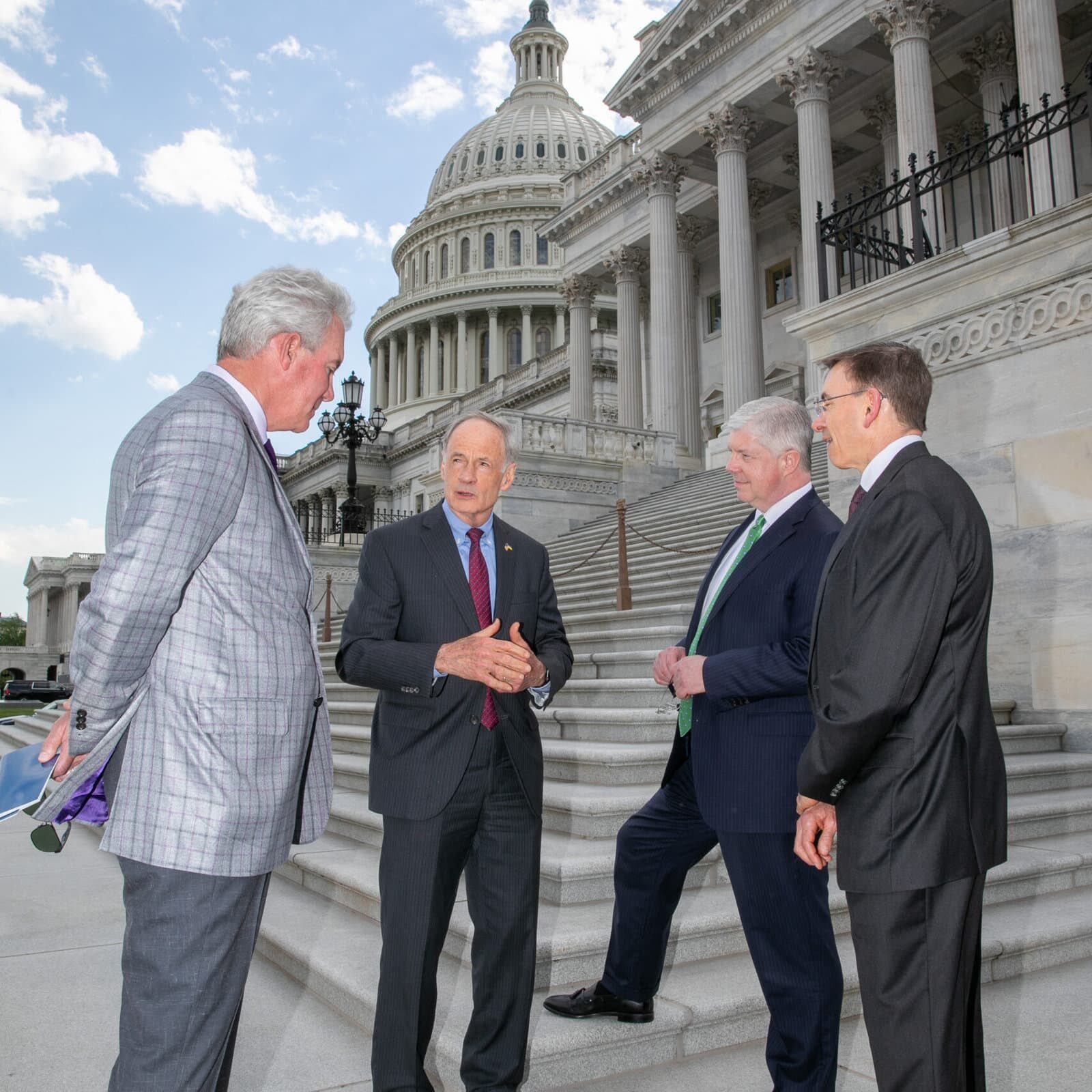 Men chatting on capitol hill steps